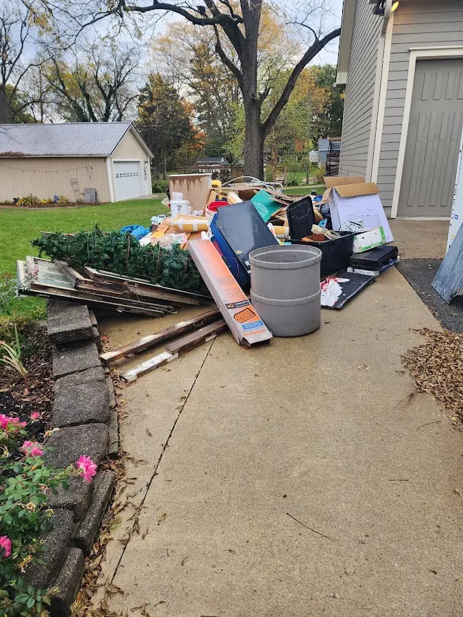 Dumpster being loaded with debris for 3 Yard Dumpster Rental in San Bruno